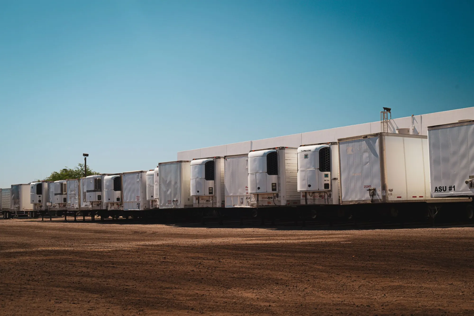 Fleet of refrigerated trucks ready for dispatch